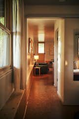 The renovation creates a clear sight line from the entry to the bedroom, which is at the back of the unit.